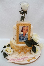 ornate gold and rose birthday cake